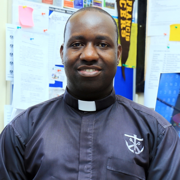 Rev. Fr. Henry Kajubi, C.S.C.